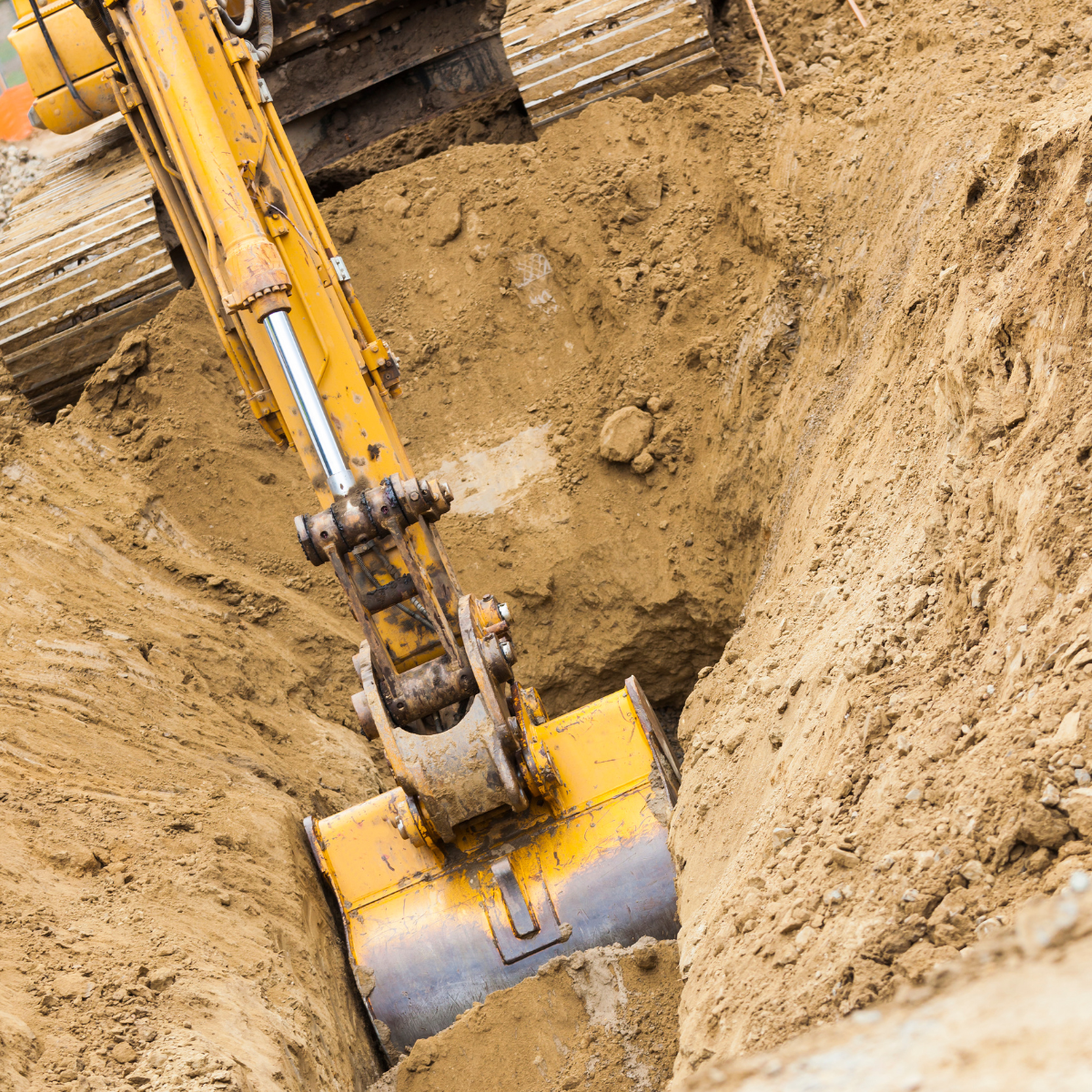 An image of a backhoe digging a trench.